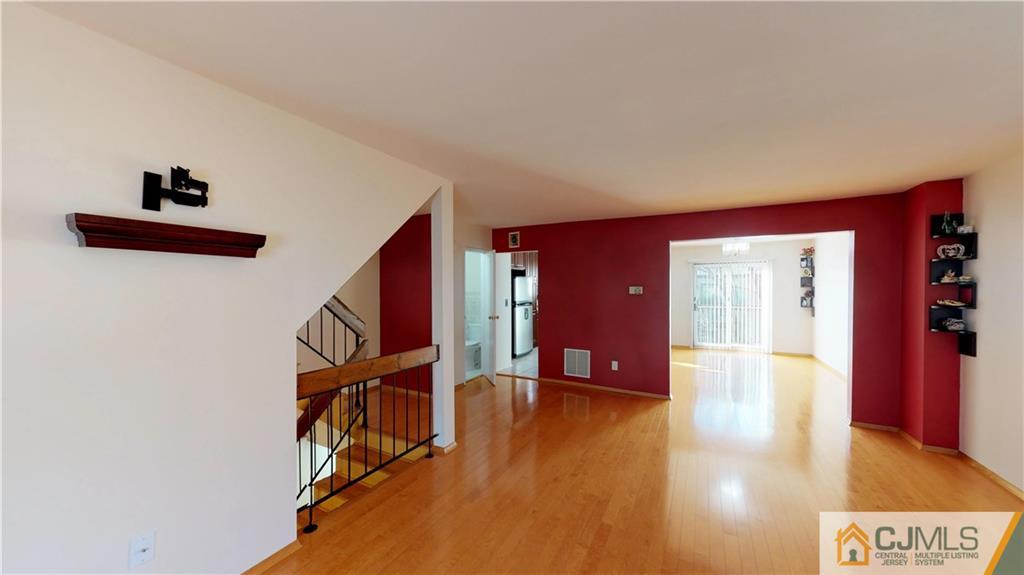 6905 Hana Road Edison, NJ 08817 - Photo 1 of 13 a view of an entryway with wooden floor