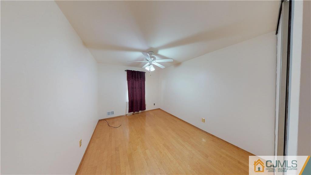 6905 Hana Road Edison, NJ 08817 - Photo 8 of 13 a view of a big room with windows
