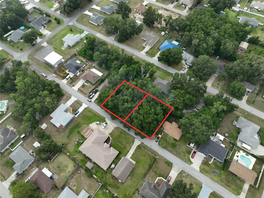 Southeast 157th Street Summerfield, FL 34491 - Photo 3 of 6 an aerial view of a residential houses with yard