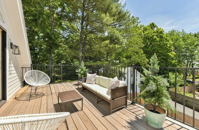 swimming pool view with a seating space