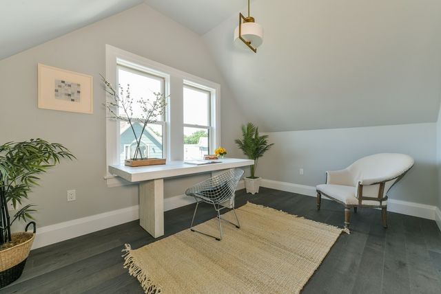 a workspace with furniture and window