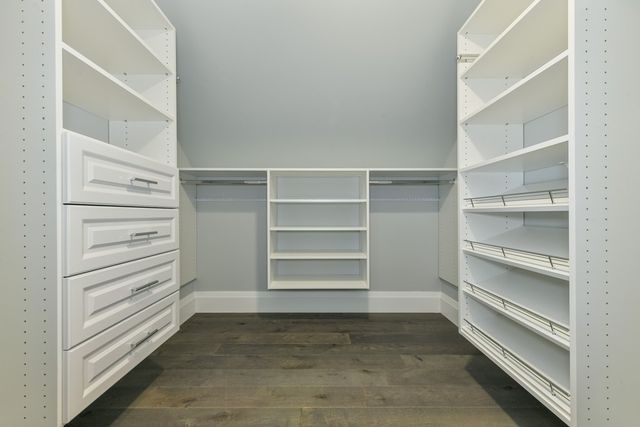 a view of an empty walk in closet