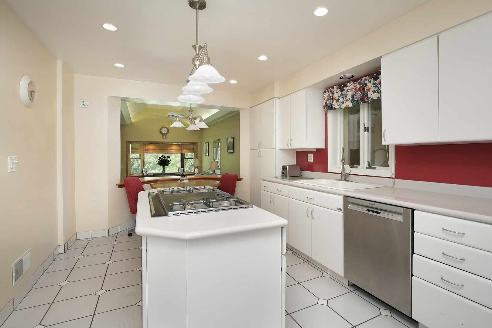 1158 Raleigh Road Glenview, IL 60025 - Photo 6 of 18 a kitchen with a sink stove and cabinets