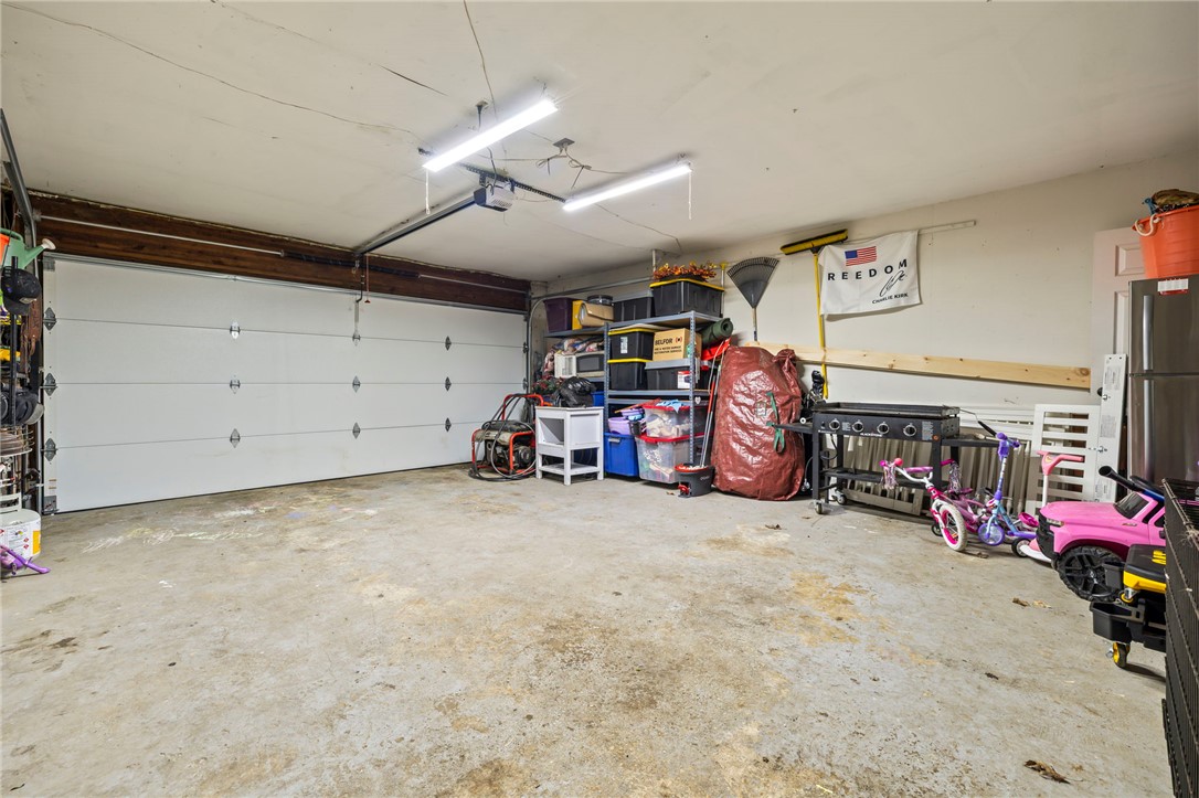 8969 Franklin-Trenton Road Franklin, OH 45005 - Photo 47 of 49 This spacious garage offers ample storage and direct access, perfect for convenience and organization.