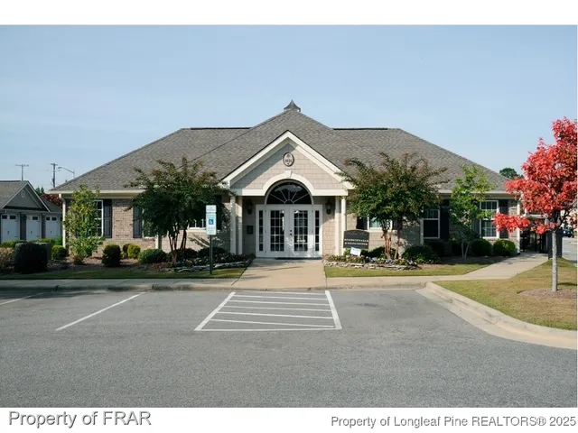 a view of a patio with swimming pool table and chairs