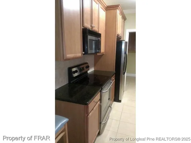 a kitchen with a sink and a microwave