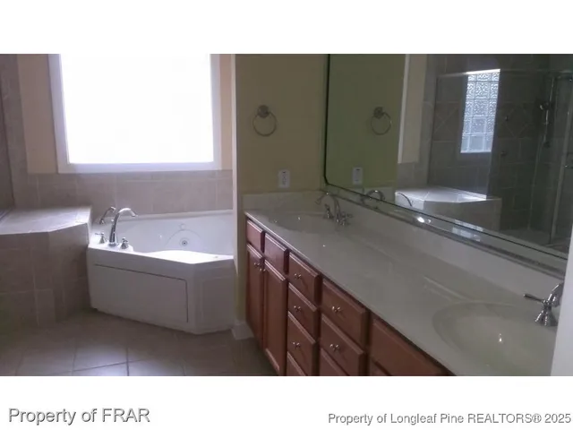 a bathroom with a shower and a sink