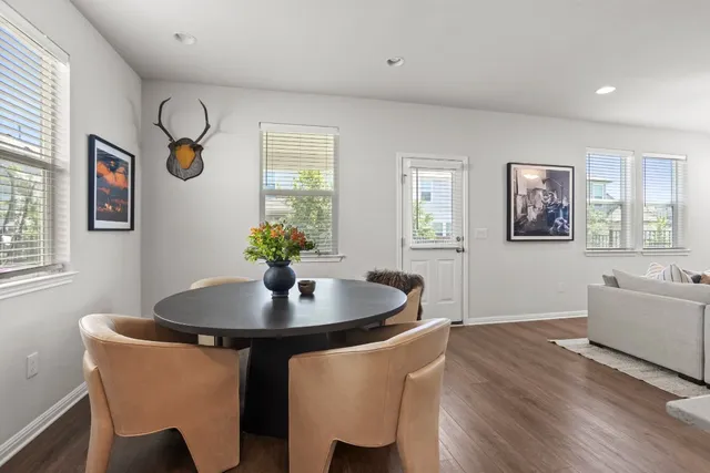 a dining room with furniture and window