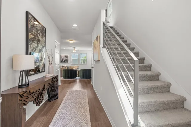 a view of a living room and entryway