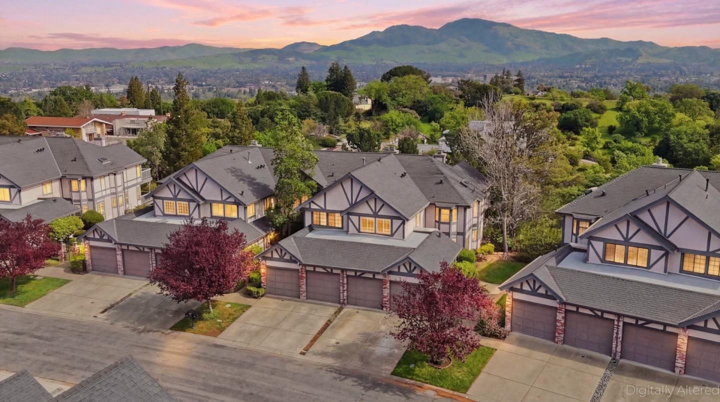 an aerial view of residential houses and outdoor space
