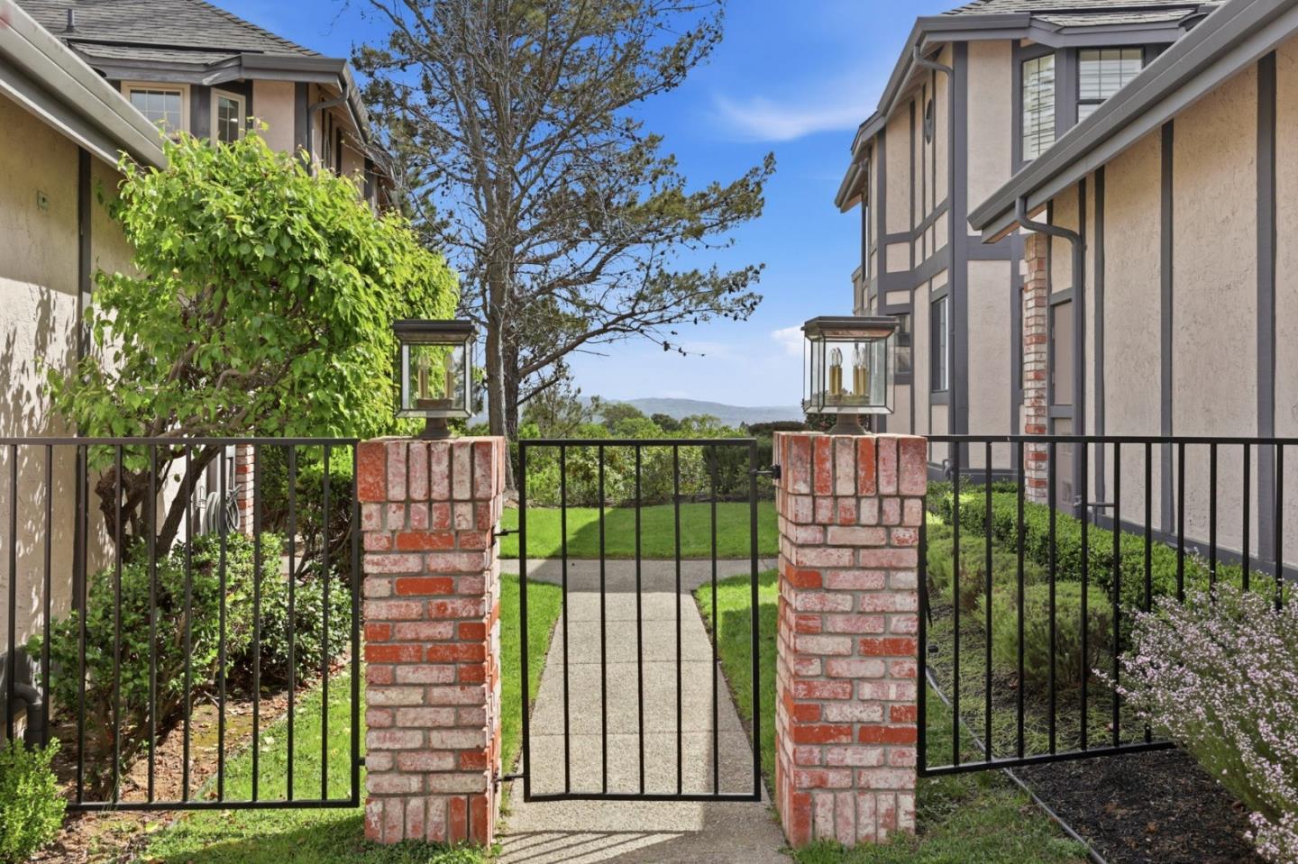 120 Haslemere Court Lafayette, CA 94549 - Photo 2 of 49 a view of a brick house with a large window and plants