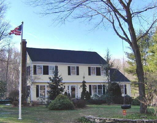 254 West Lane Ridgefield, CT 06877 - Photo 1 of 1 front view of a house with a yard
