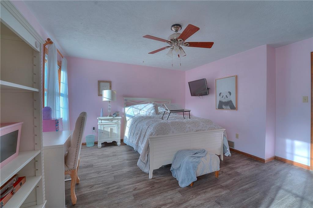 257 Arbor Hill Road Greensburg, PA 15601 - Photo 14 of 26 a bed room with a bed and a chair