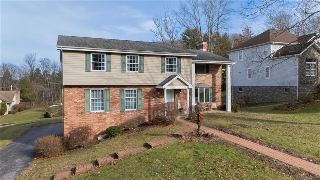 257 Arbor Hill Road Greensburg, PA 15601 - Photo 26 of 26 a front view of a house with garden