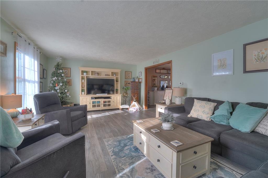 257 Arbor Hill Road Greensburg, PA 15601 - Photo 3 of 26 a living room with furniture and a flat screen tv