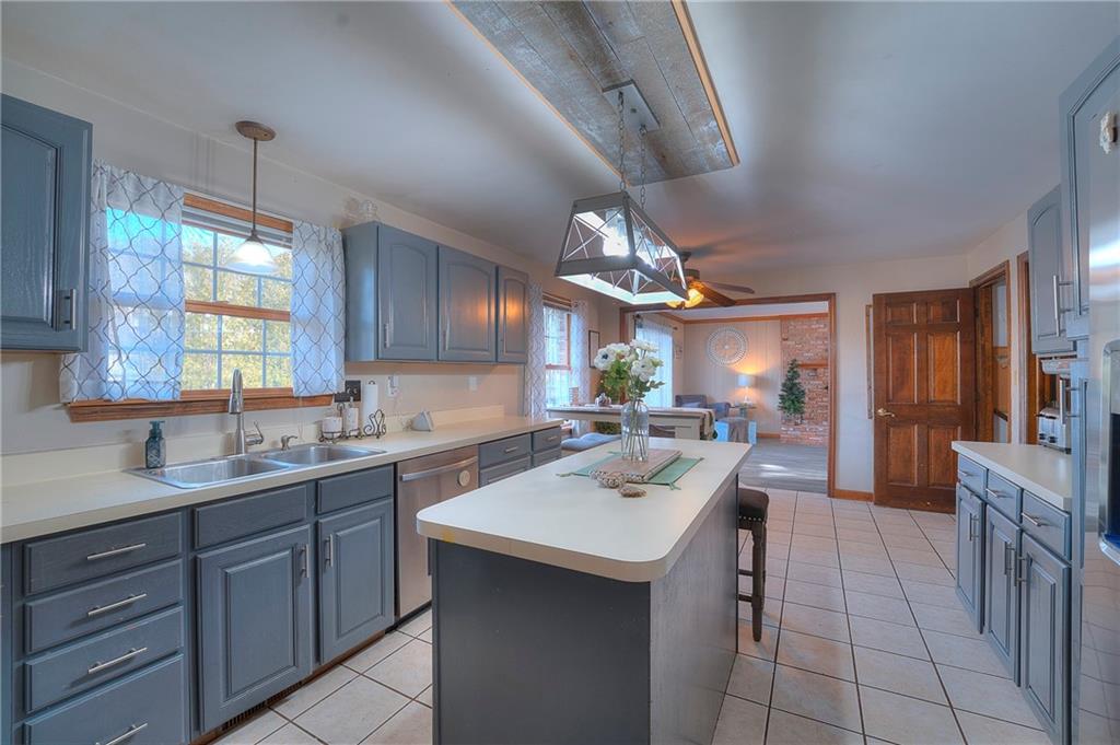 257 Arbor Hill Road Greensburg, PA 15601 - Photo 8 of 26 a kitchen with a sink a counter space appliances and cabinets