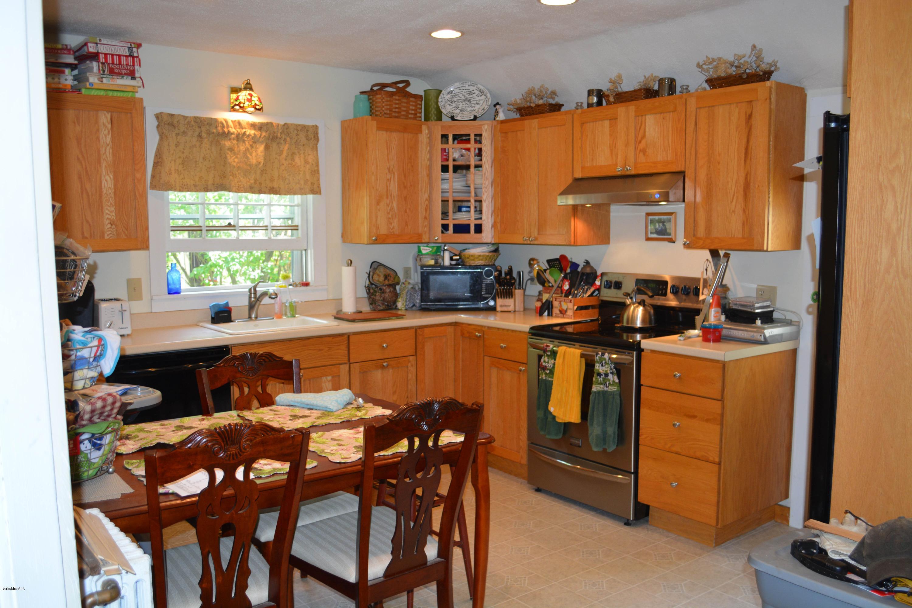 392 Polikoff Road Sheffield, MA 01222 - Photo 8 of 20 a view of a dining room with furniture window and outside view