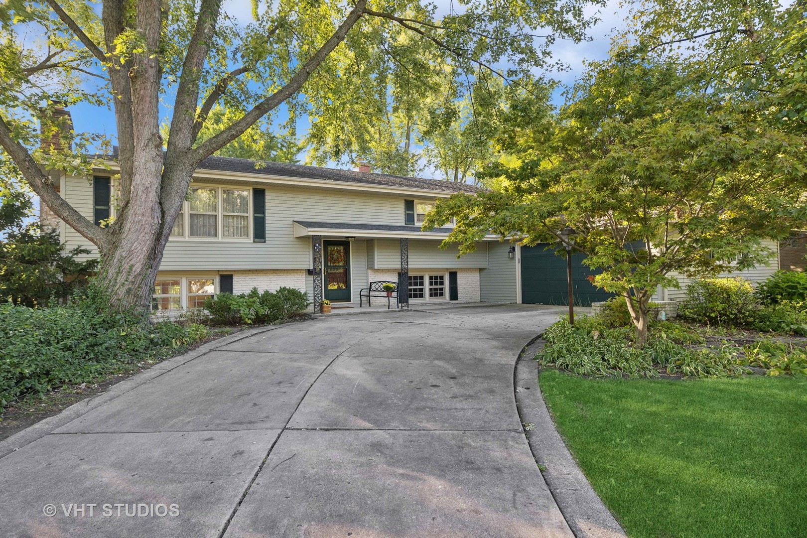 450 West Gartner Road Naperville, IL 60540 - Photo 1 of 31 a front view of a house with a yard and a tree
