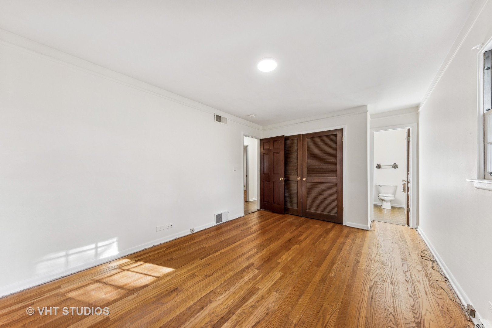 450 West Gartner Road Naperville, IL 60540 - Photo 11 of 31 a view of an empty room with wooden floor