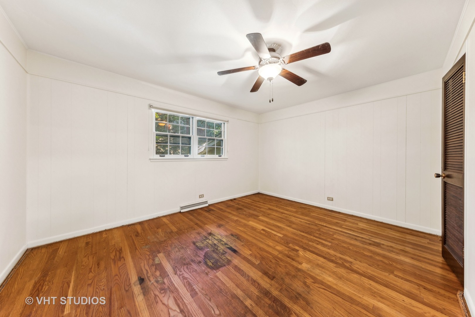 450 West Gartner Road Naperville, IL 60540 - Photo 12 of 31 a view of empty room with wooden floor and fan