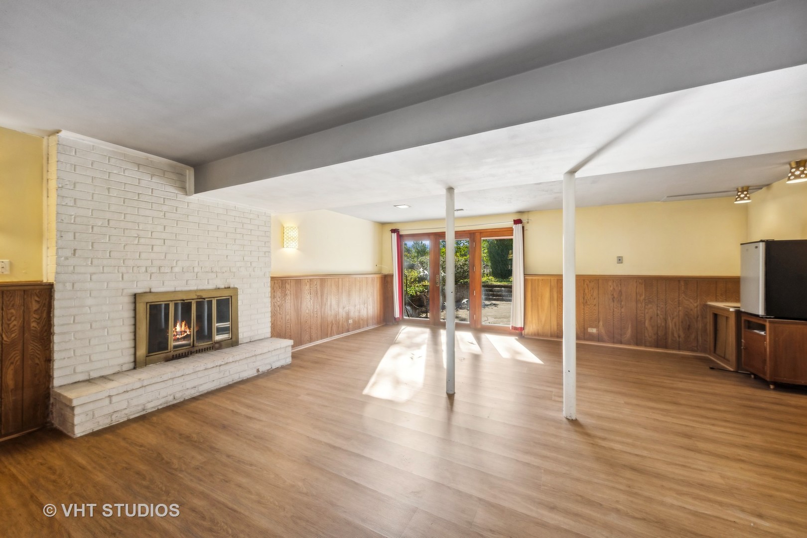 450 West Gartner Road Naperville, IL 60540 - Photo 17 of 31 a view of a livingroom with wooden floor and a fireplace