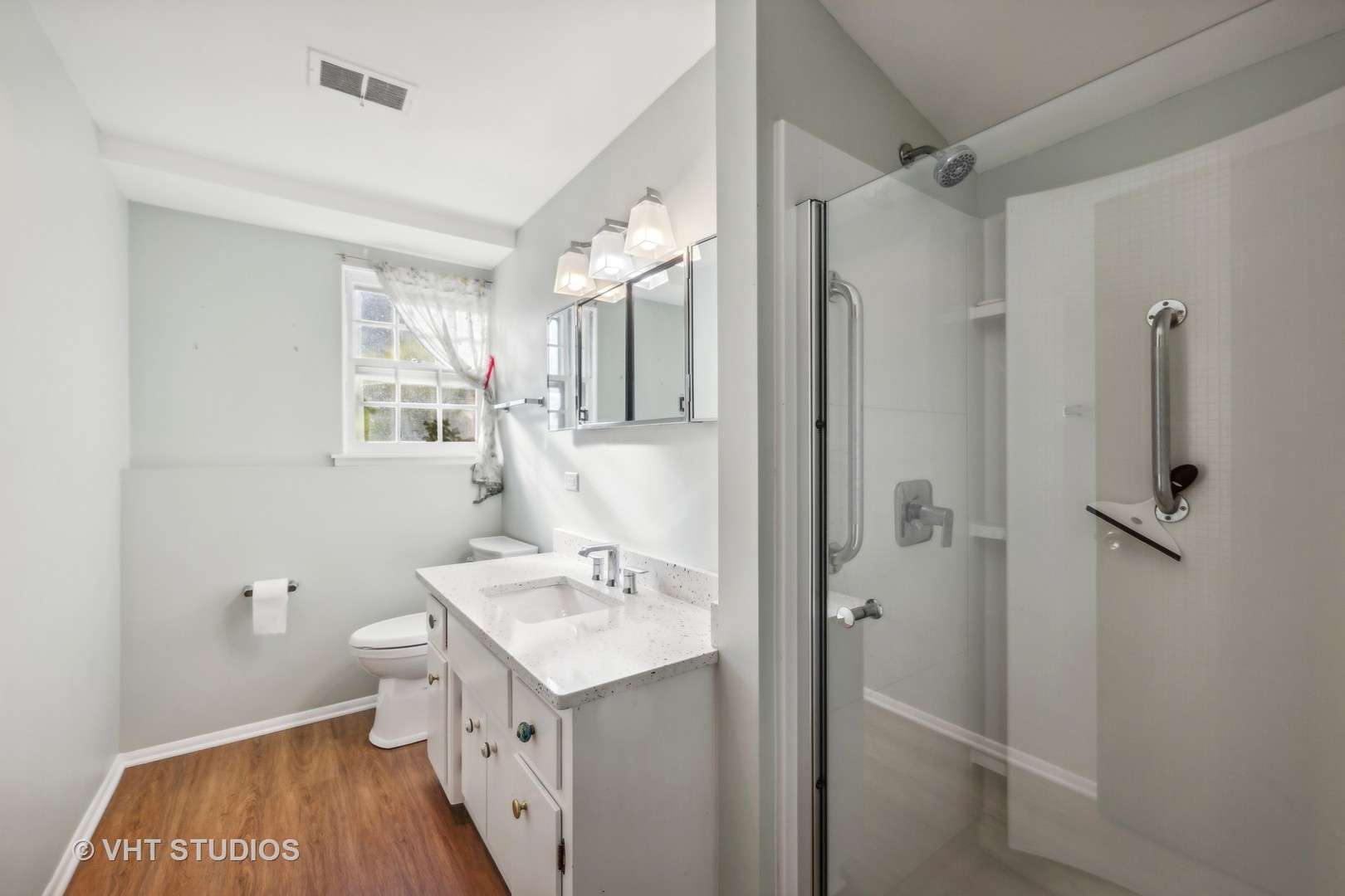 450 West Gartner Road Naperville, IL 60540 - Photo 19 of 31 a bathroom with a sink toilet and shower