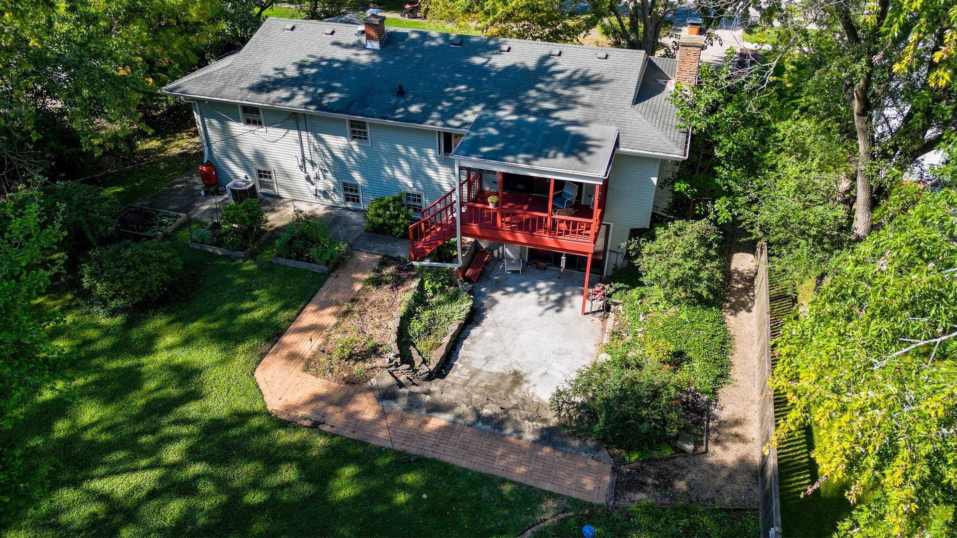 450 West Gartner Road Naperville, IL 60540 - Photo 29 of 31 an aerial view of a house with garden space and sitting area
