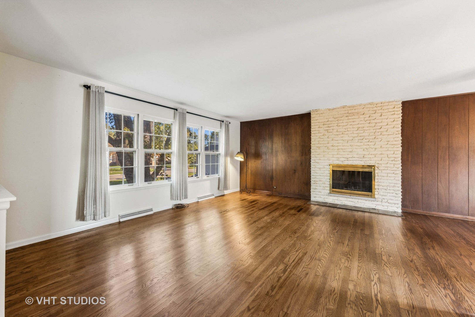 450 West Gartner Road Naperville, IL 60540 - Photo 3 of 31 a view of an empty room with wooden floor and a window