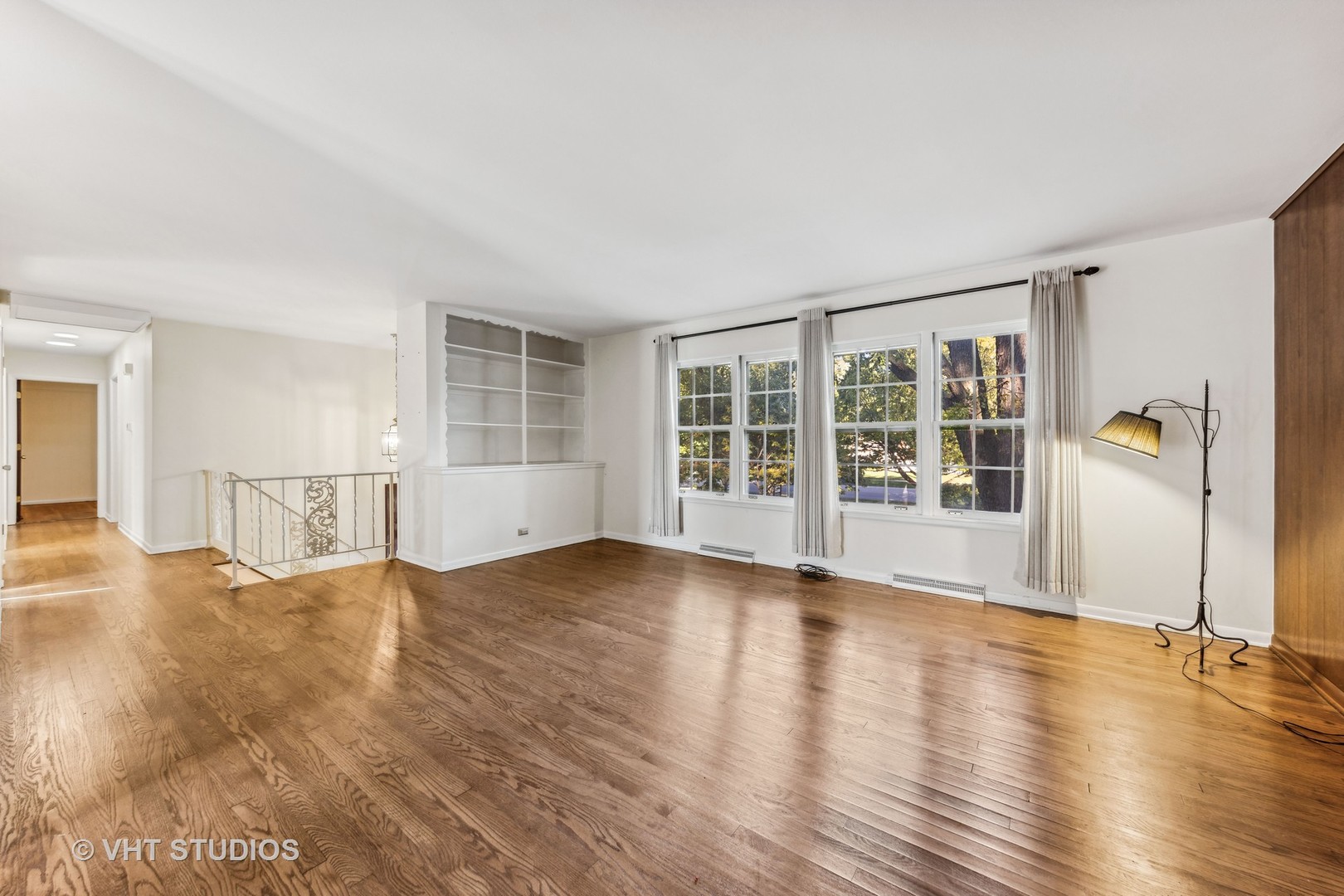 450 West Gartner Road Naperville, IL 60540 - Photo 4 of 31 a view of an empty room with wooden floor and a window