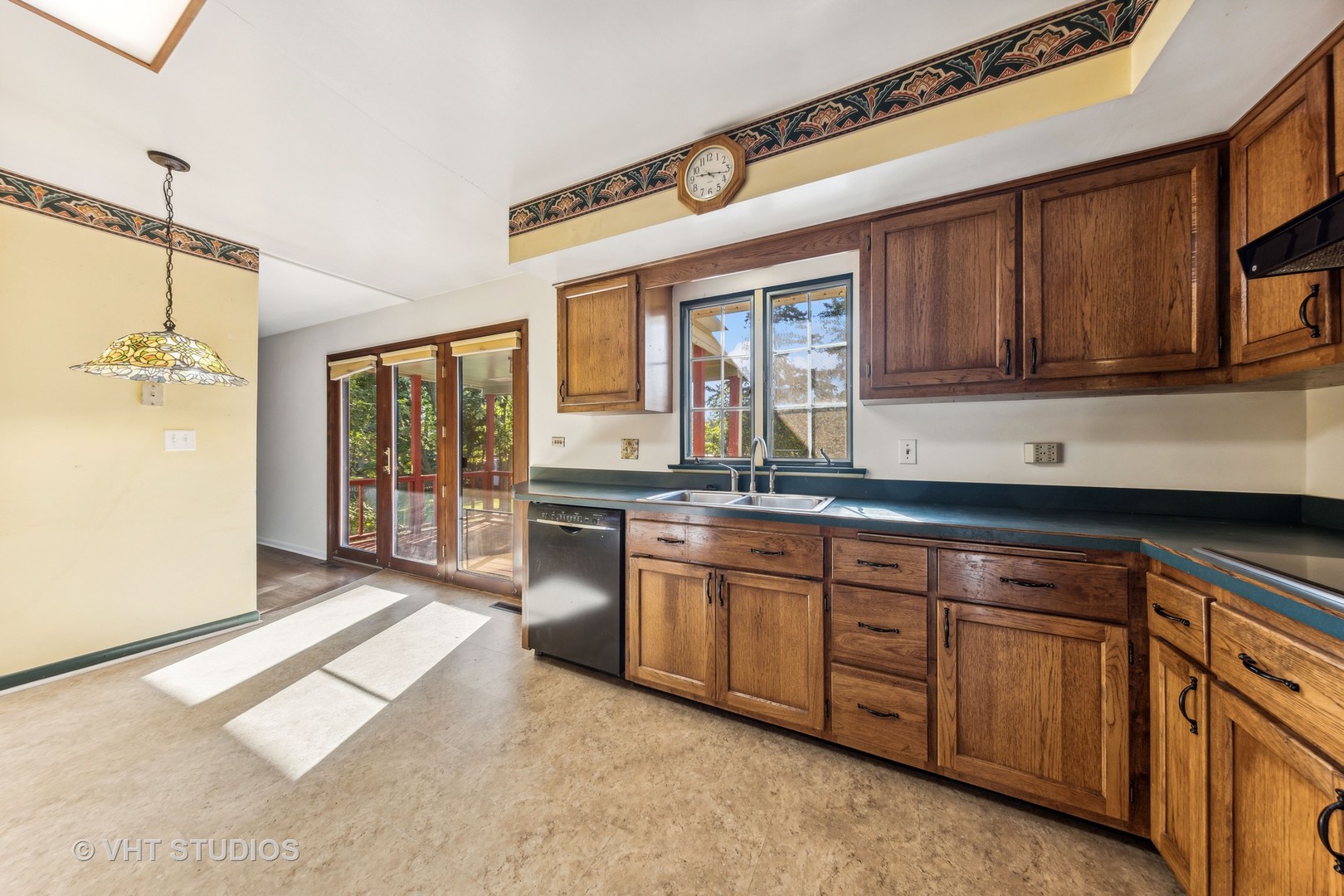 450 West Gartner Road Naperville, IL 60540 - Photo 7 of 31 a kitchen with granite countertop a sink and cabinets