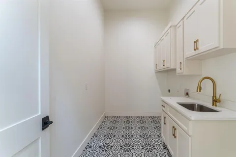 a kitchen with a sink and cabinets
