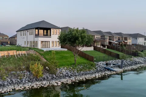 an aerial view of a city with lake view