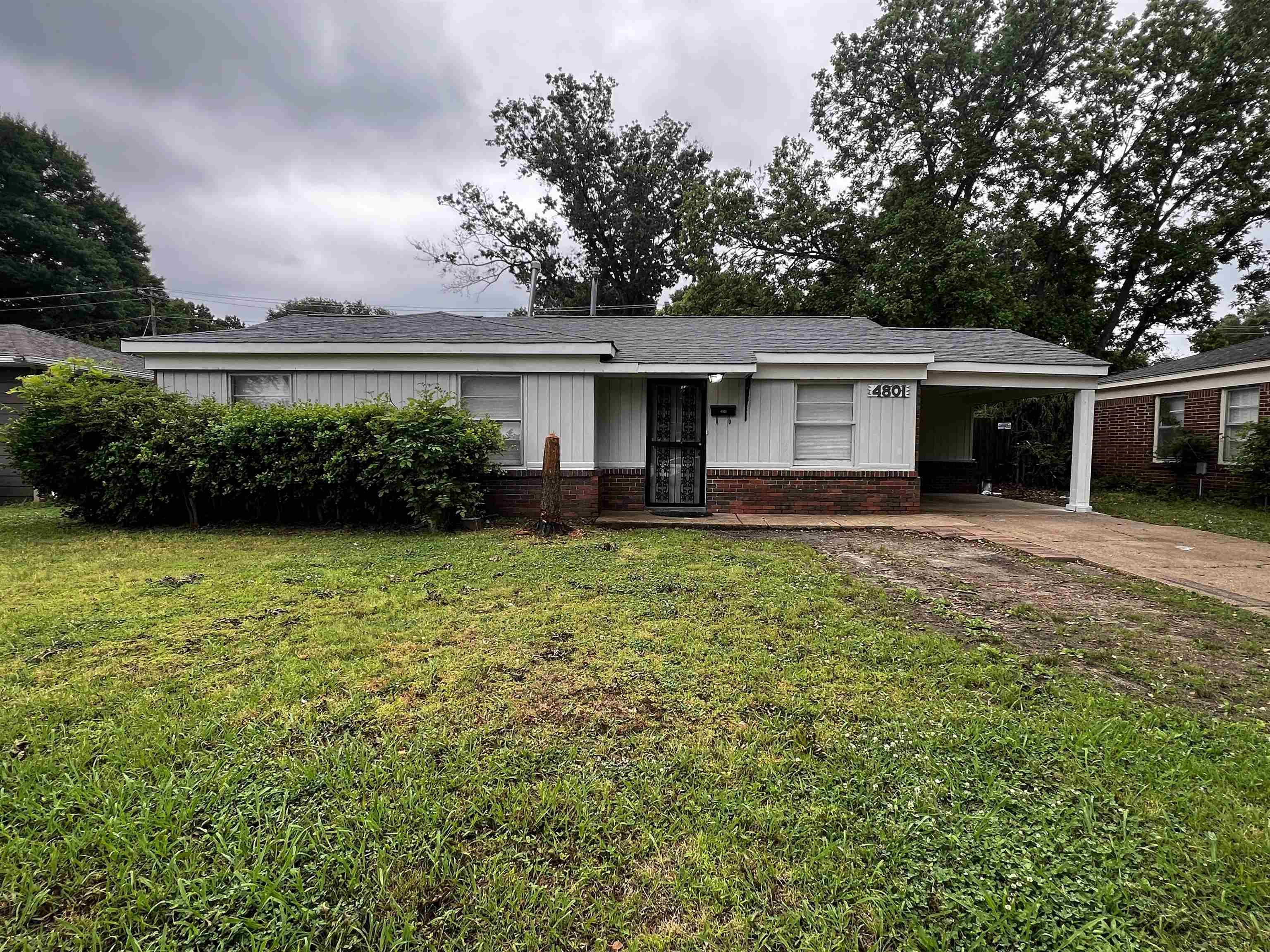 front view of a house with a yard