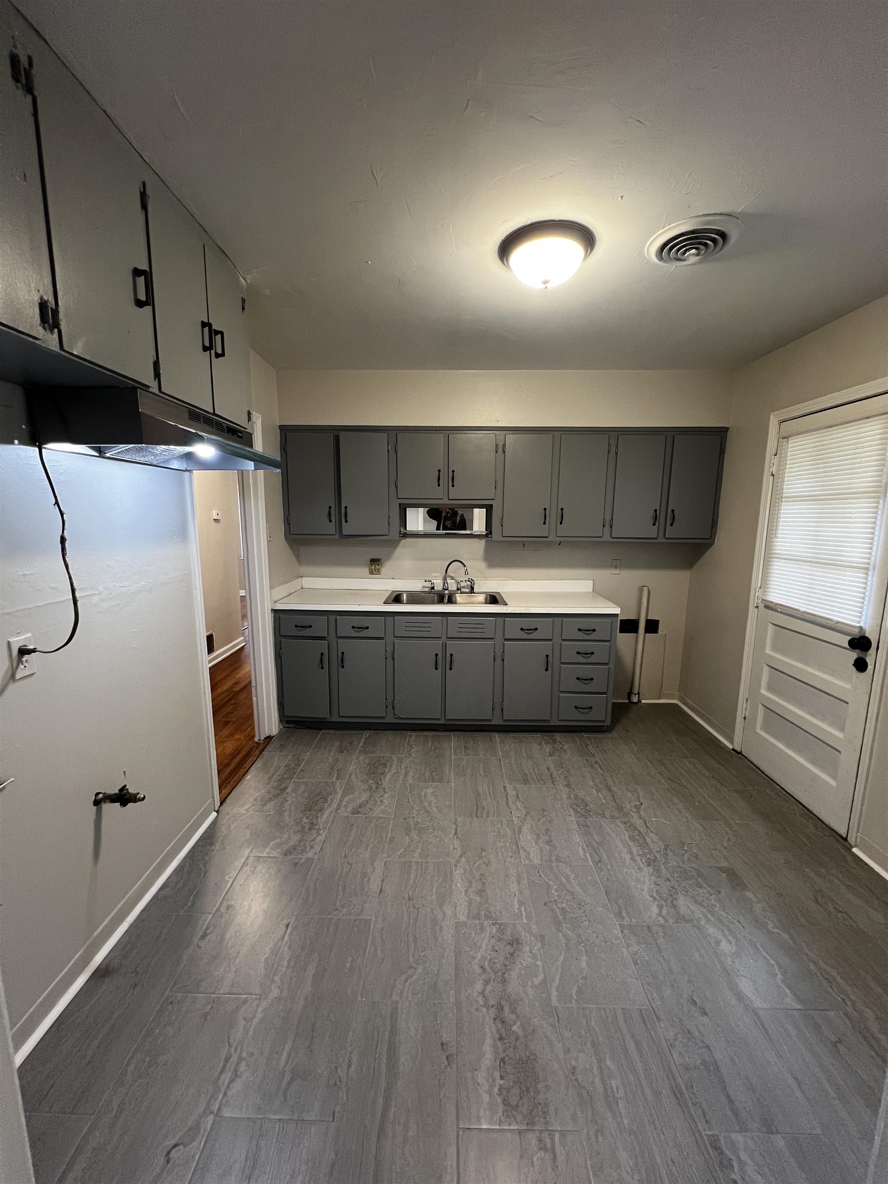 4801 Given Avenue Memphis, TN 38122 - Photo 2 of 13 a kitchen with stainless steel appliances a refrigerator sink and cabinets