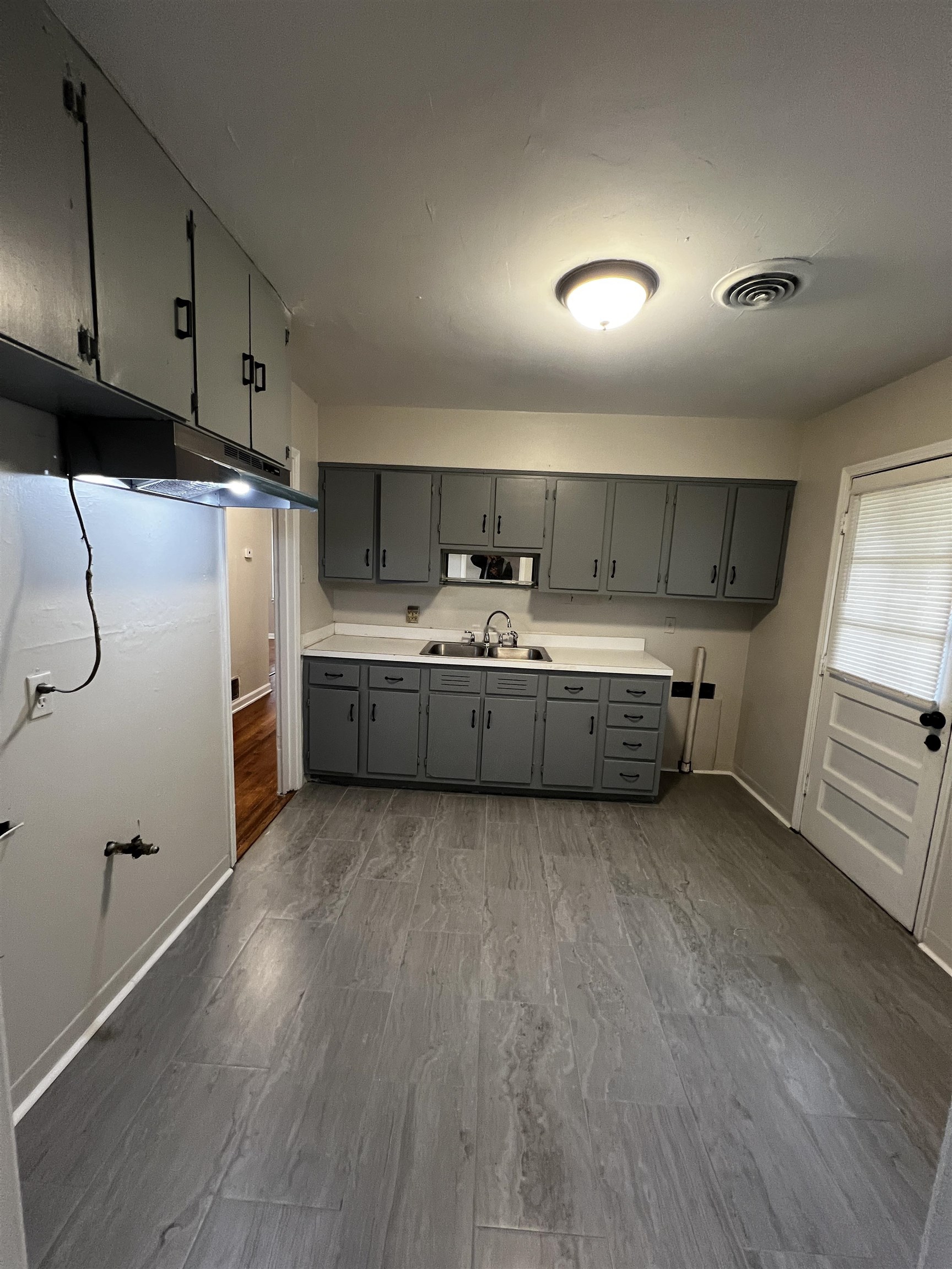 4801 Given Avenue Memphis, TN 38122 - Photo 3 of 13 a kitchen with cabinets a sink and appliances