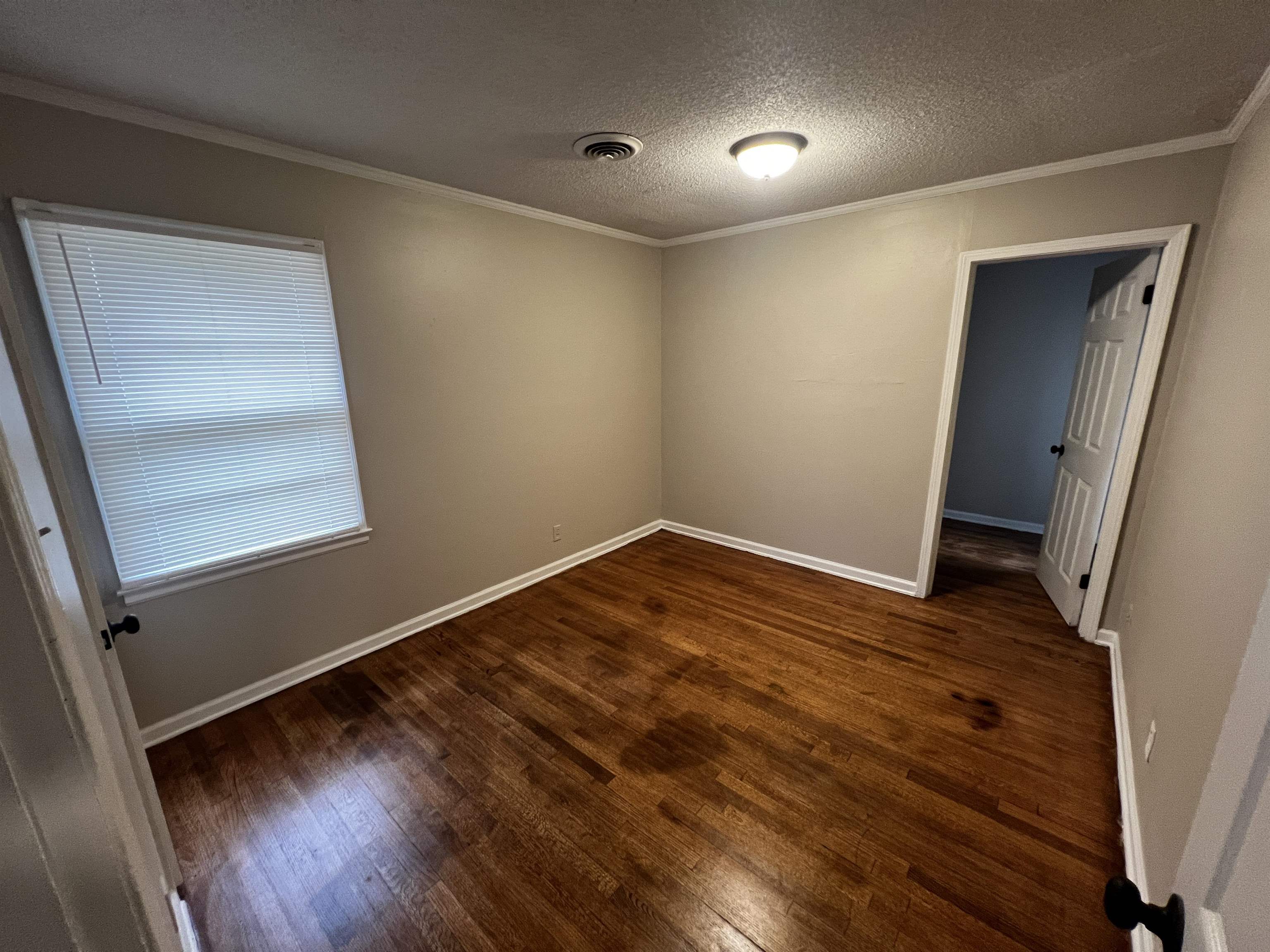 4801 Given Avenue Memphis, TN 38122 - Photo 6 of 13 wooden floor in an empty room with a window