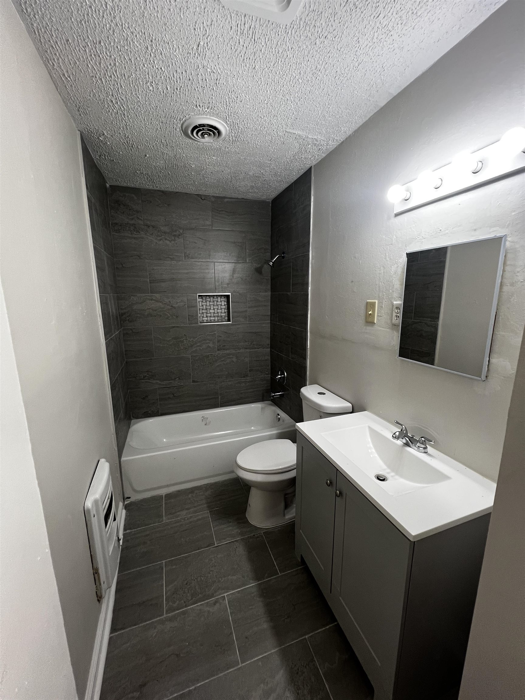 4801 Given Avenue Memphis, TN 38122 - Photo 10 of 13 a bathroom with a sink a toilet and shower