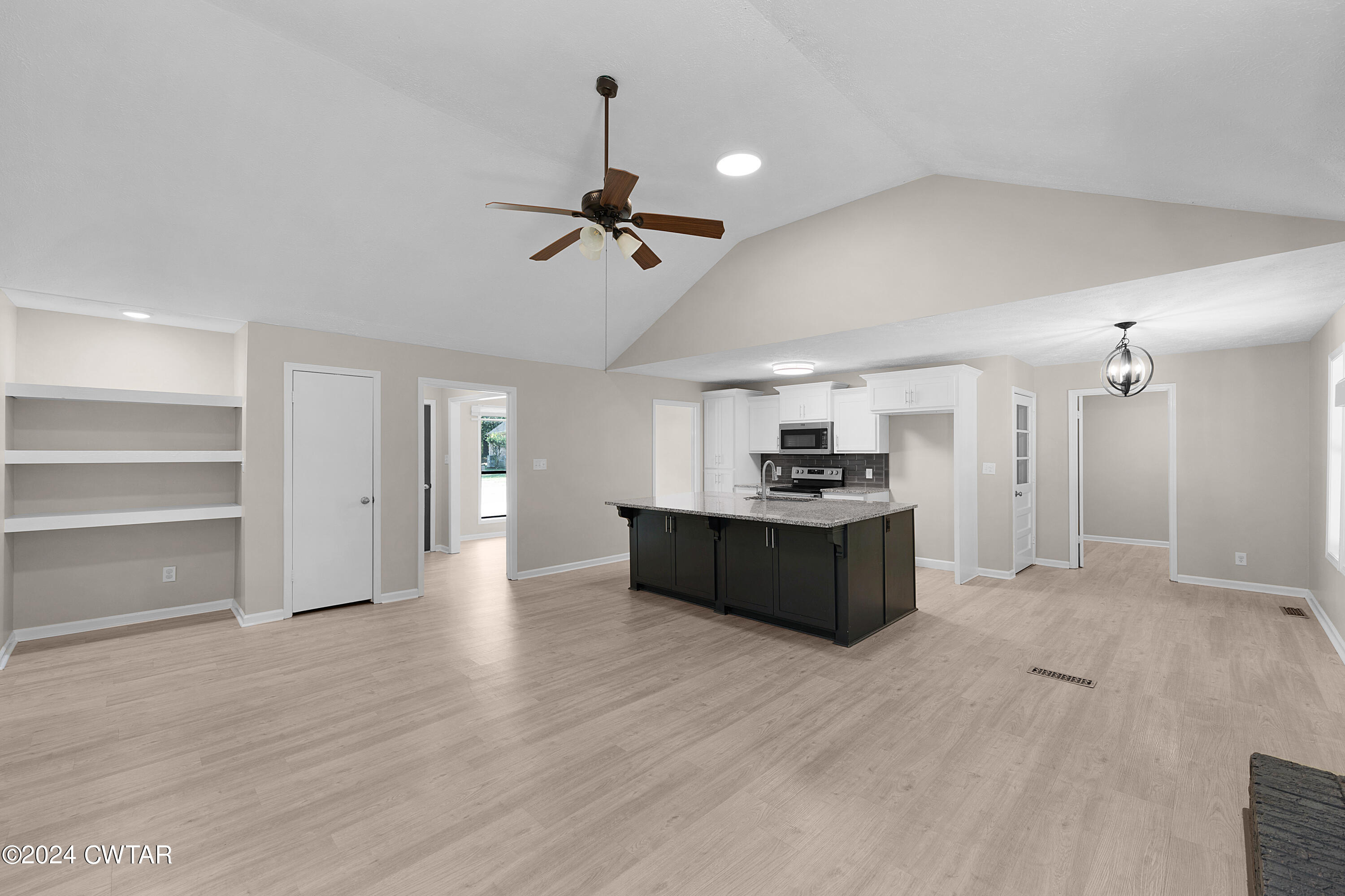 117 Ridgeoak Place Jackson, TN 38305 - Photo 11 of 20 a large room with a lot of cabinets and wooden floor
