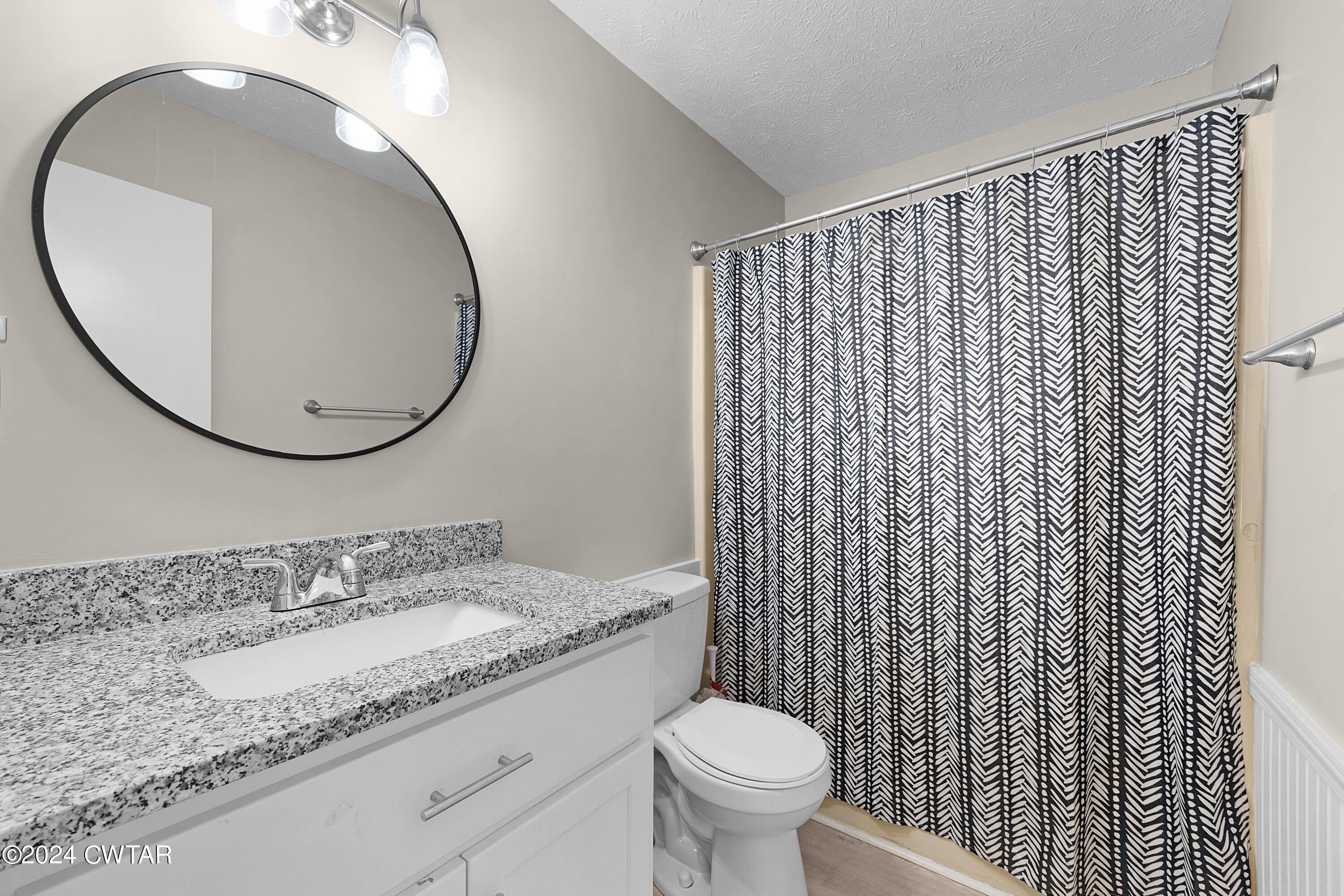 117 Ridgeoak Place Jackson, TN 38305 - Photo 16 of 20 a bathroom with a granite countertop sink and a mirror