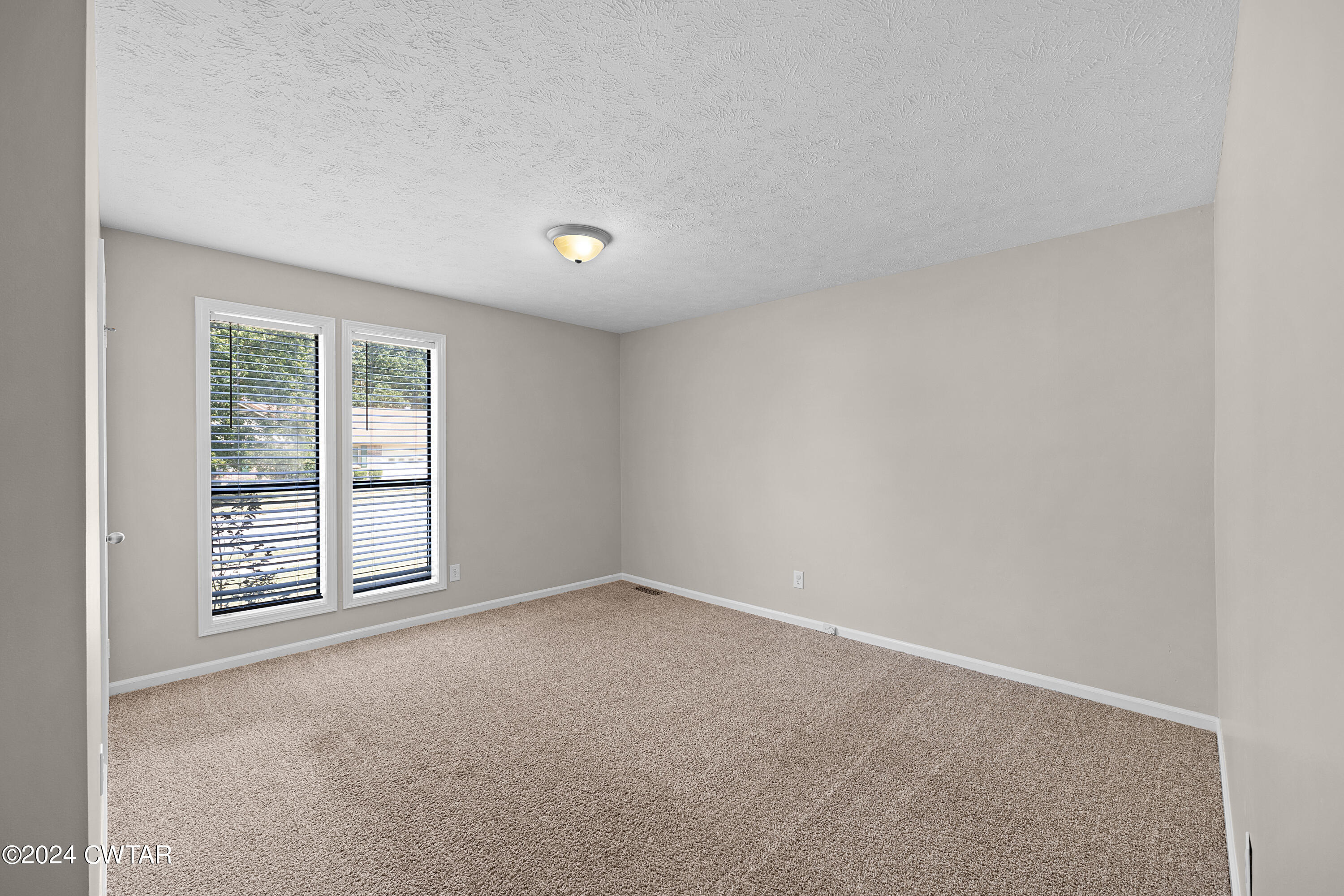 117 Ridgeoak Place Jackson, TN 38305 - Photo 17 of 20 an empty room with windows