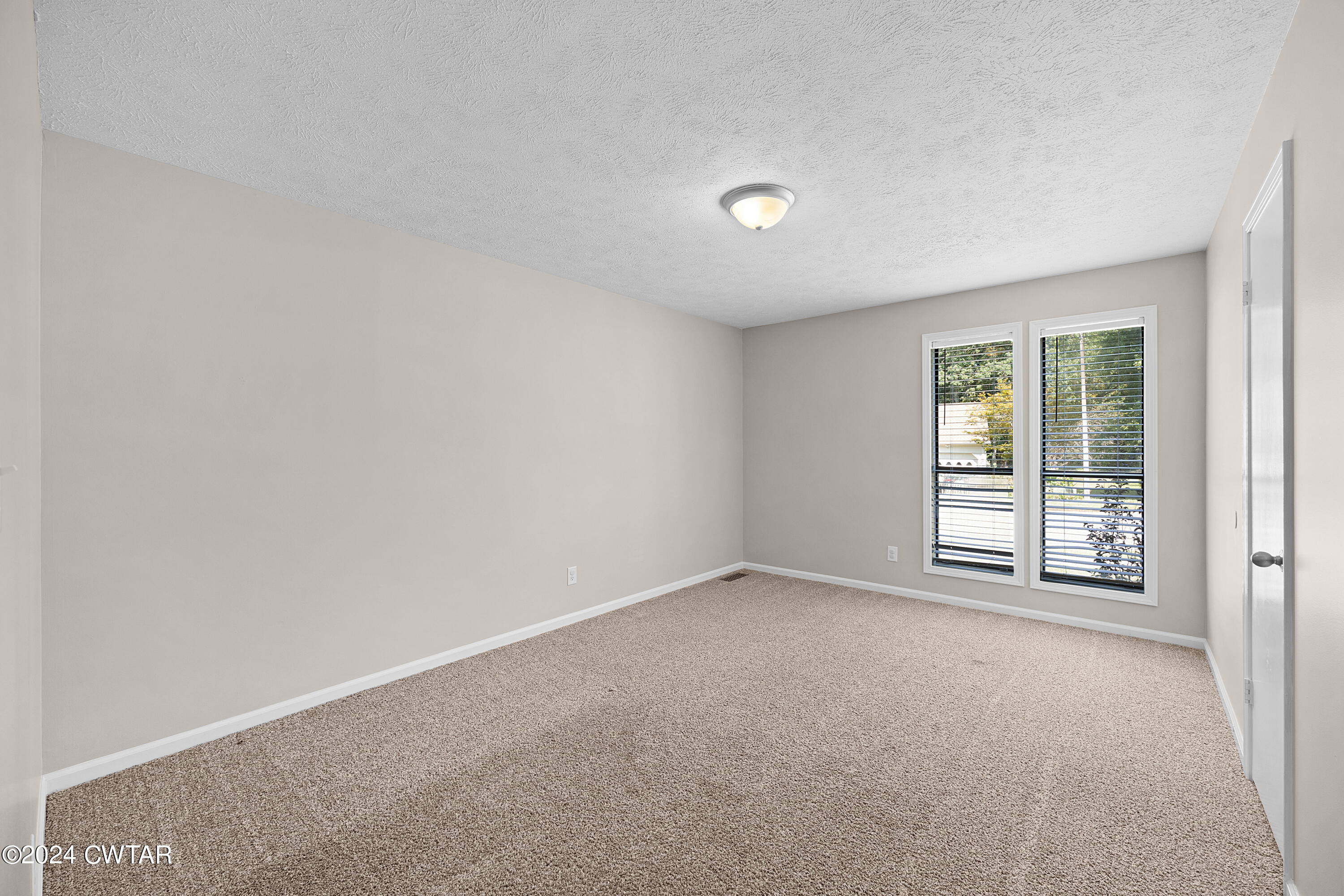 117 Ridgeoak Place Jackson, TN 38305 - Photo 18 of 20 an empty room with windows