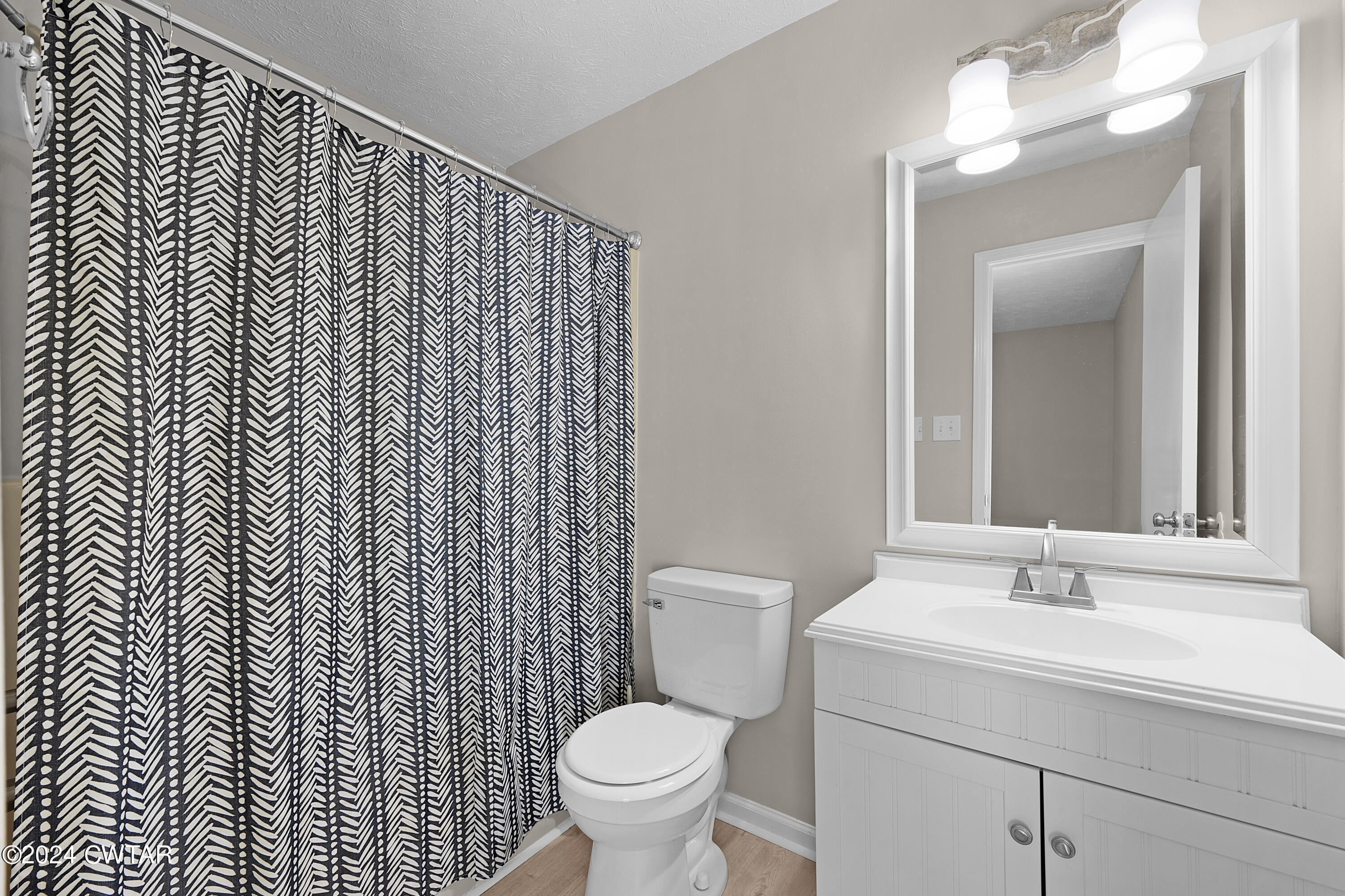 117 Ridgeoak Place Jackson, TN 38305 - Photo 20 of 20 a bathroom with a sink toilet and a mirror