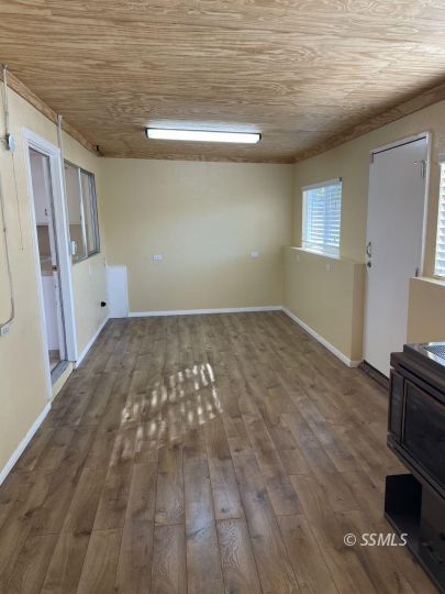 337 Peg Street Ridgecrest, CA 93555 - Photo 24 of 33 a view of empty room with wooden floor and fan