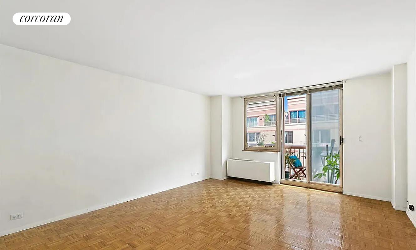 350 West 50th Street, Unit 4BB Manhattan, NY 10019 - Photo 1 of 14 a view of an empty room with a window