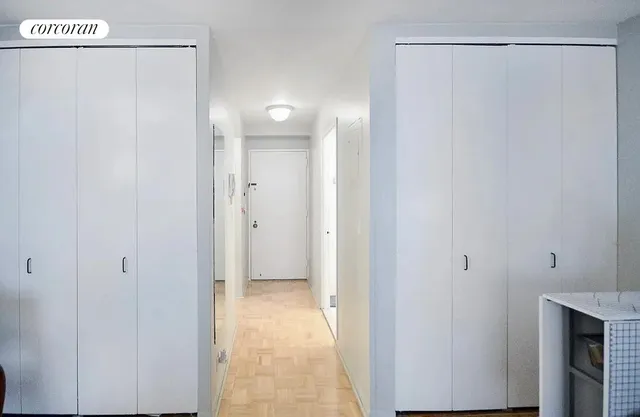 a view of a bathroom with a shower and a sink