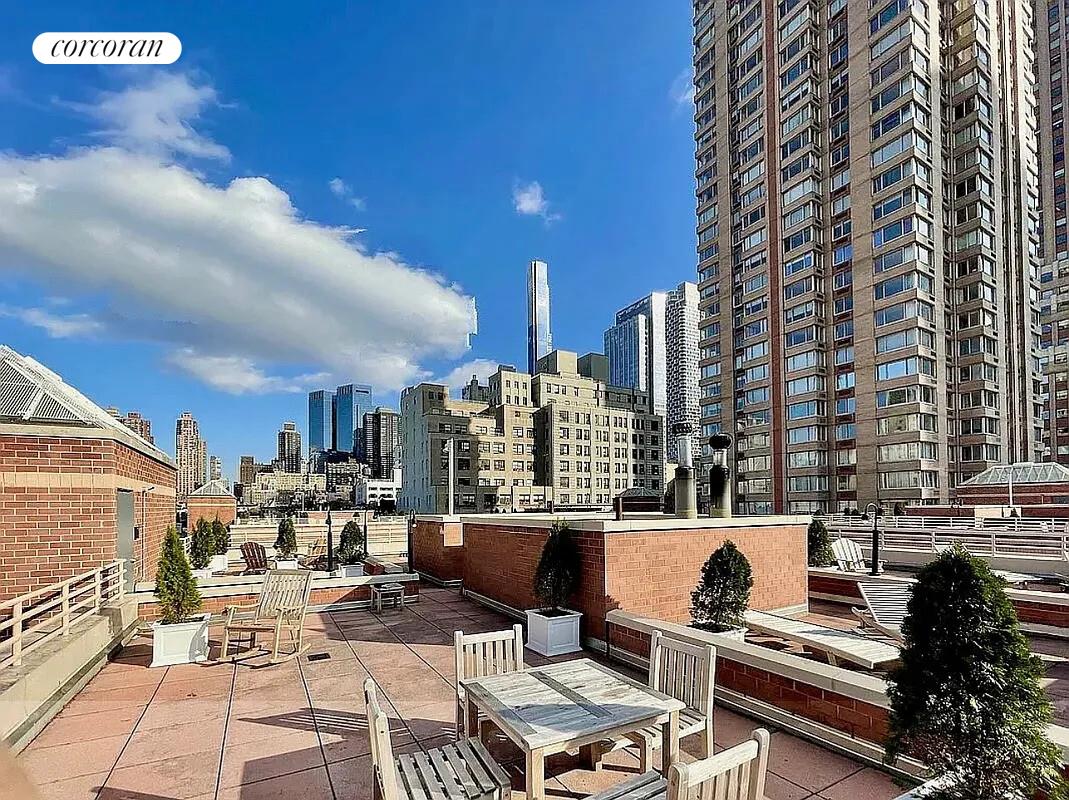 350 West 50th Street, Unit 4BB Manhattan, NY 10019 - Photo 6 of 14 a view of a city with tall buildings