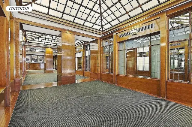 a view of empty room with floor to ceiling window and windows
