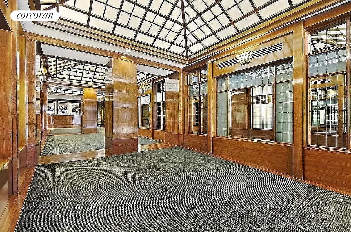 350 West 50th Street, Unit 4BB Manhattan, NY 10019 - Photo 9 of 14 a view of empty room with floor to ceiling window and windows