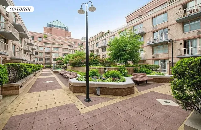 a view of a patio with couches and potted plants