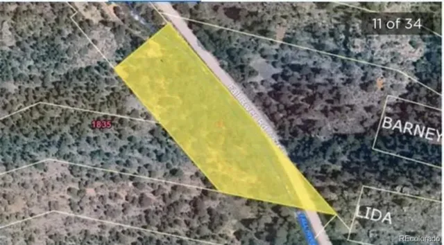 a view of a swimming pool with sitting area